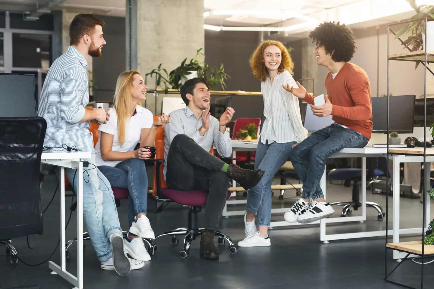 Colleagues sharing a light moment in a modern office